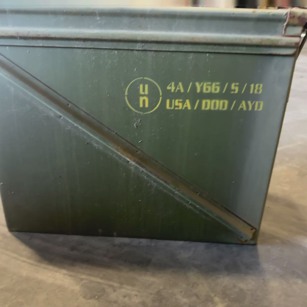 Video showing a Vietnam-era UN Army green ammunition box with olive drab paint, stenciled markings and hinged lid.