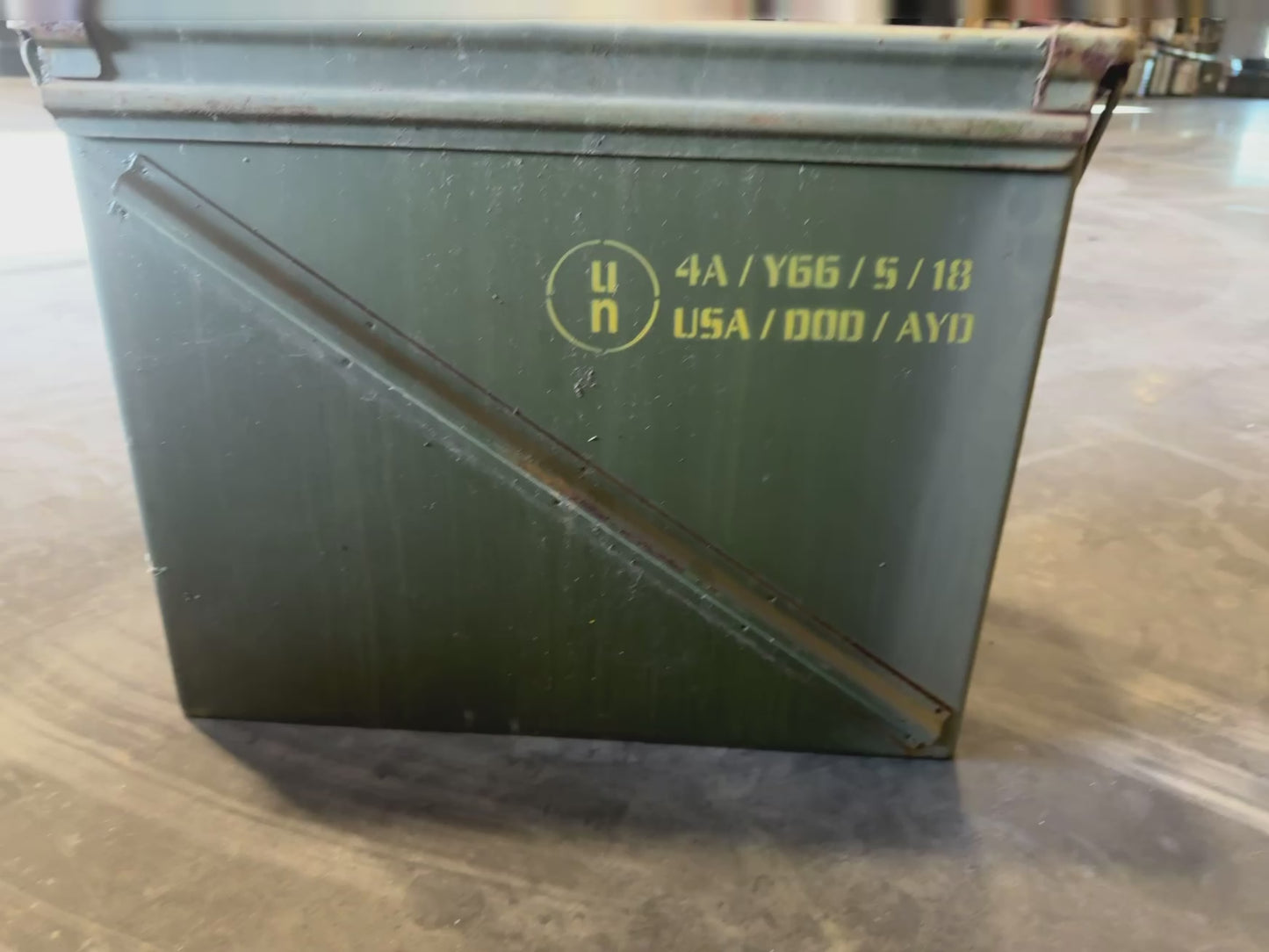 Video showing a Vietnam-era UN Army green ammunition box with olive drab paint, stenciled markings and hinged lid.
