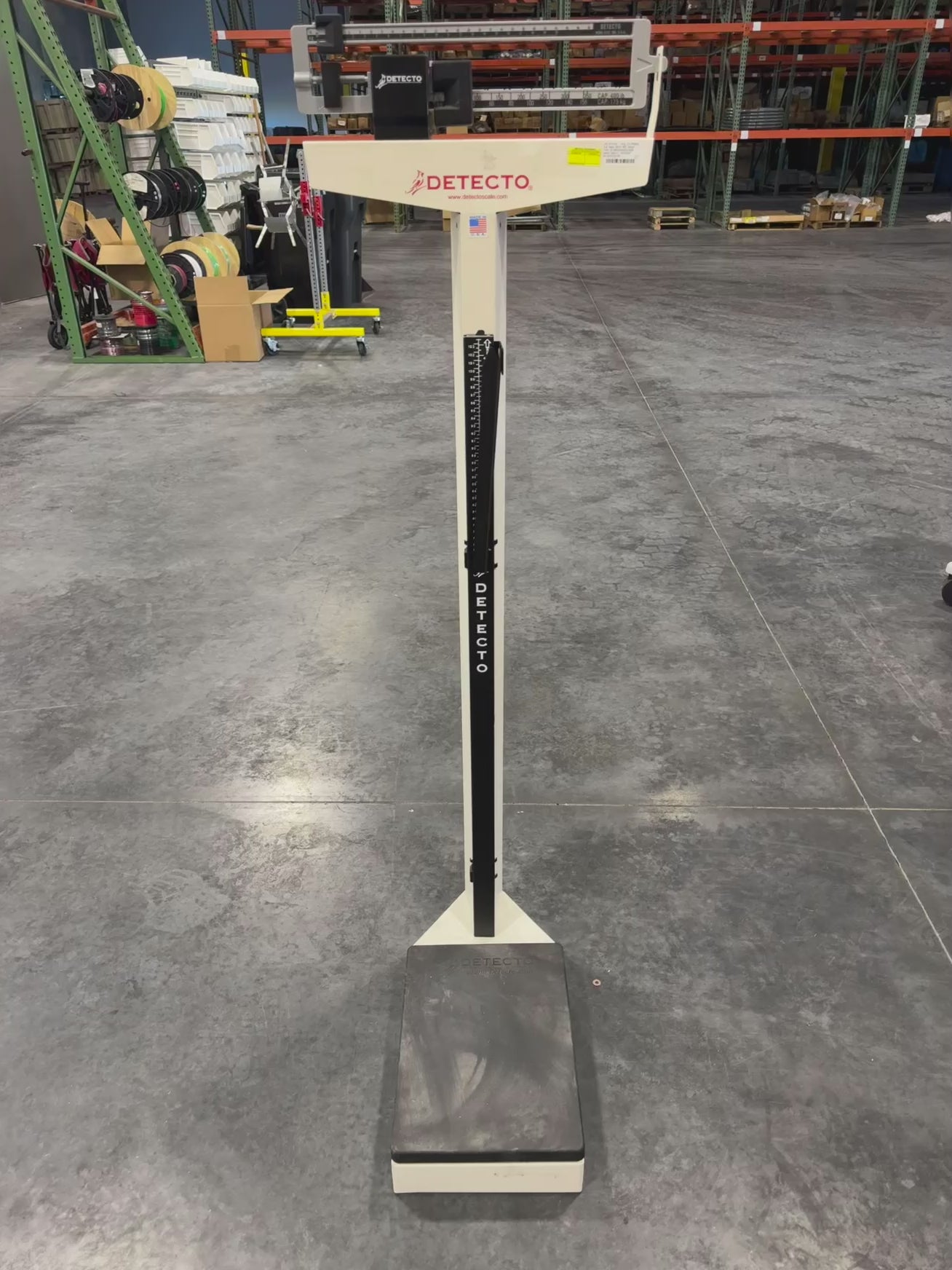 Video rotating Detecto Eye-Level Physician Scale showing base, height rod, and weight beam.