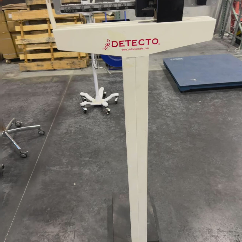 Video demonstration of Detecto Eye-Level Physician Scale with height rod, showing weight reading and height rod measurement in use.