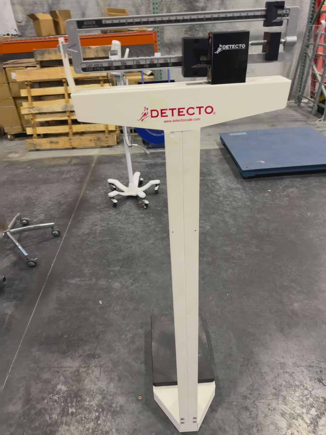 Video demonstration of Detecto Eye-Level Physician Scale with height rod, showing weight reading and height rod measurement in use.